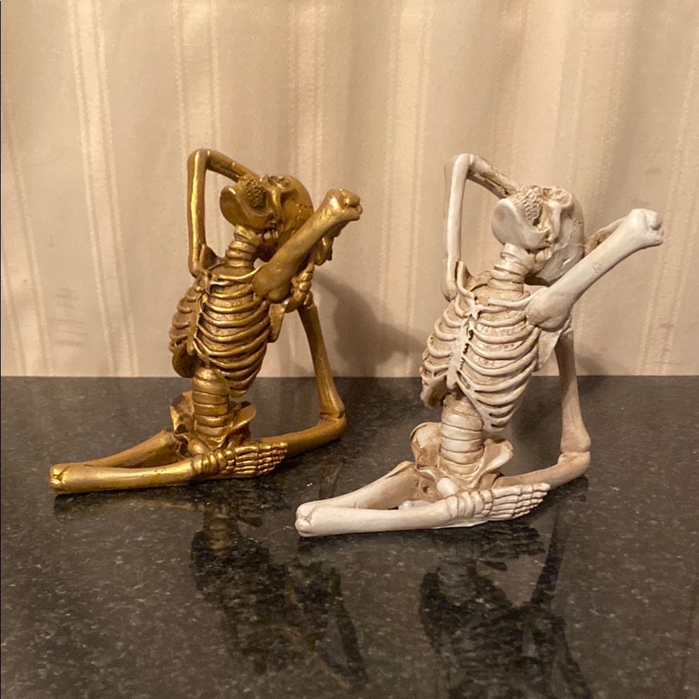 Gold and White Skeleton Figurines
